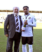 Darren McQueen receives Player of the Month award from Co-Chairman Steve Irving.